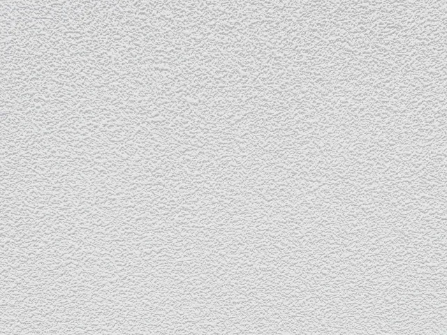 凹凸のある、白い壁紙